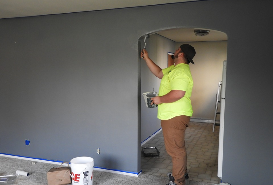 a person painting the wall