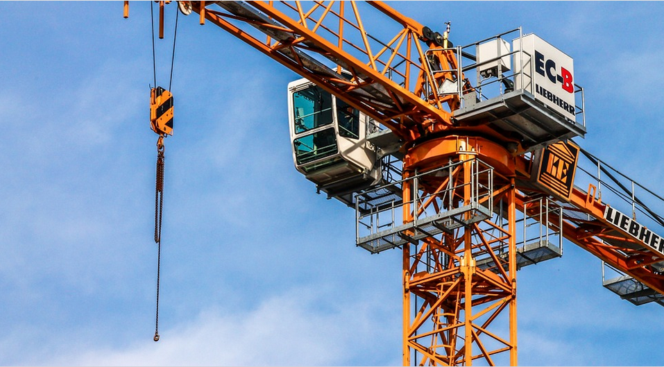 a crane using chain drive to lift loads